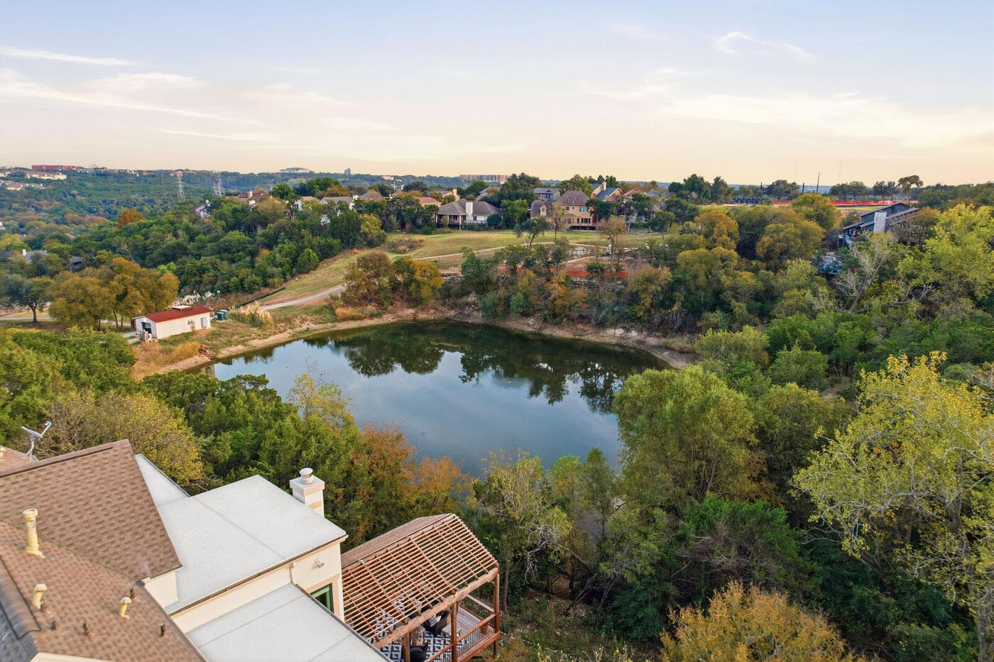 Aerial view over a lake and neighborhood